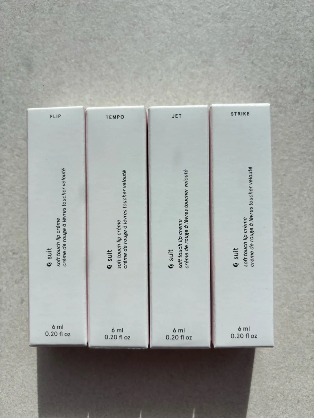 Glossier Soft Touch Lip Creme set of 4 Strike, Jet, Flip, Tempo